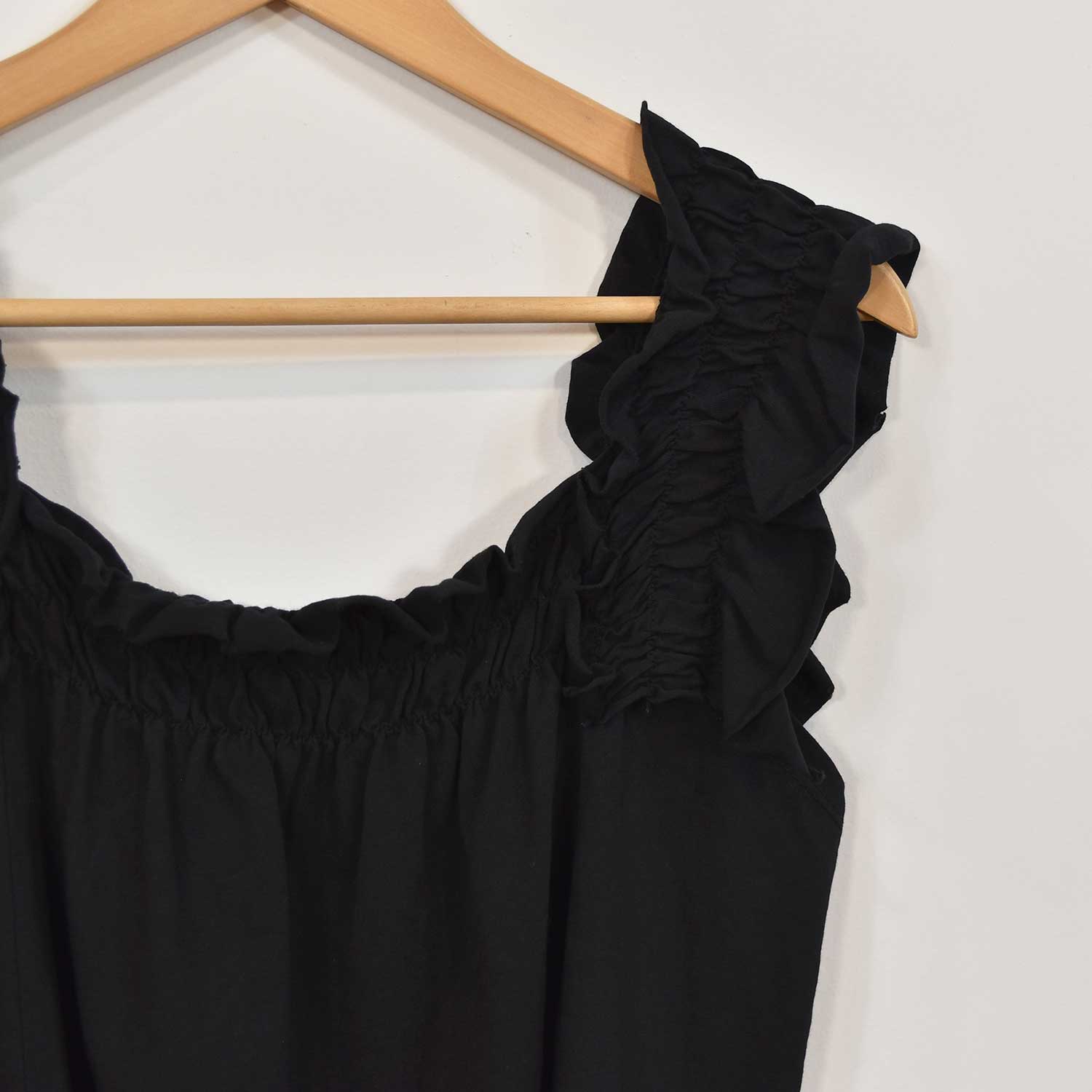 Black ruffled t-shirt