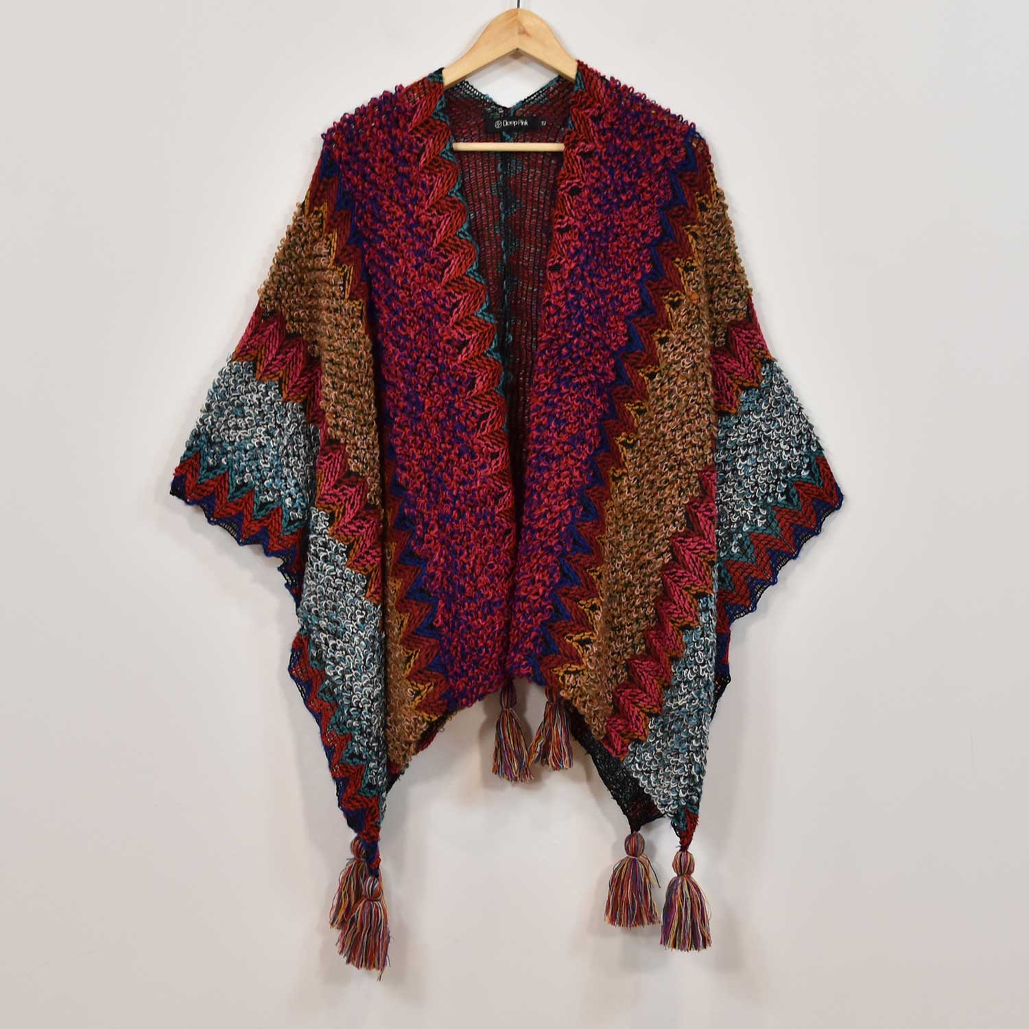 Poncho flecos fucsia