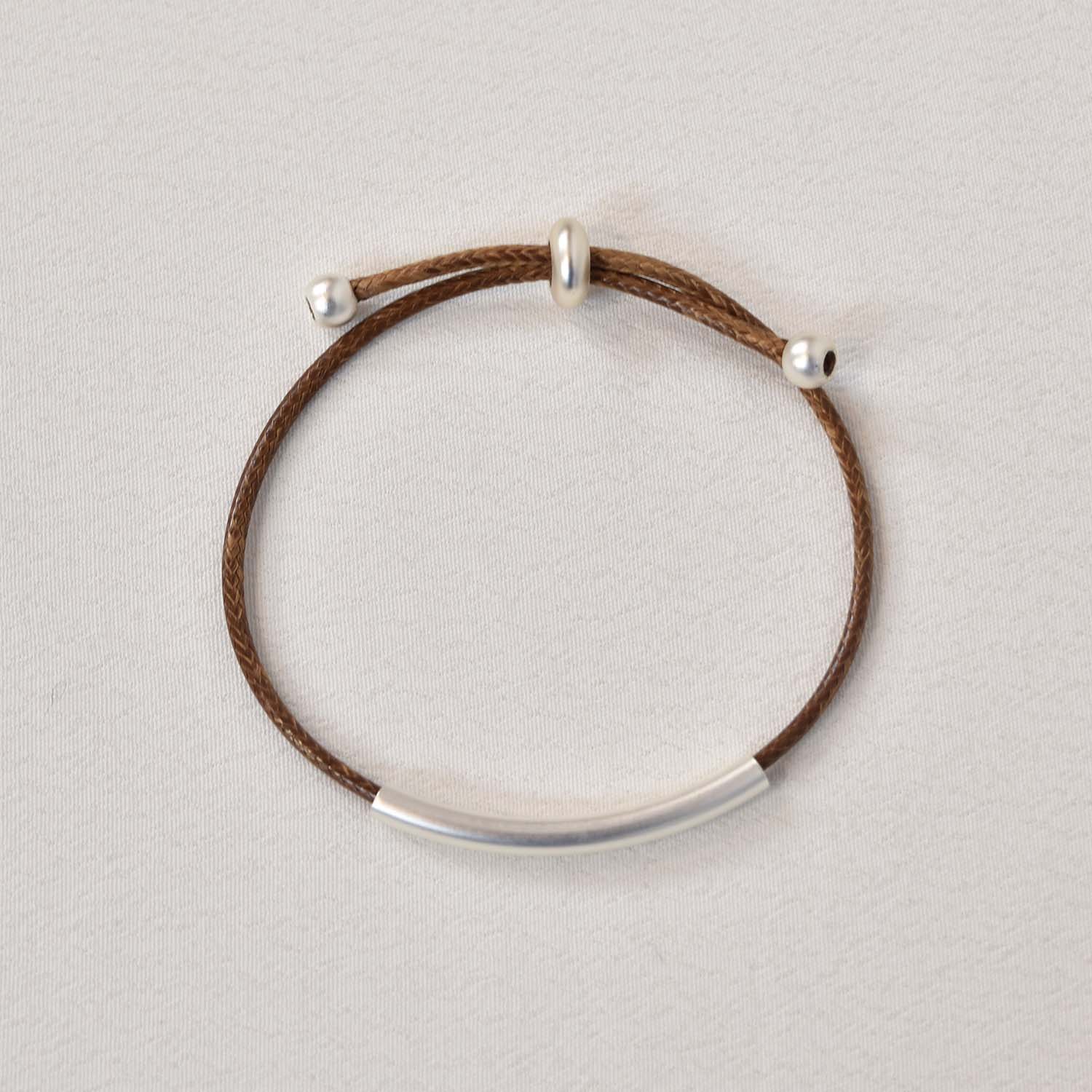 Waxed brown tube bracelet
