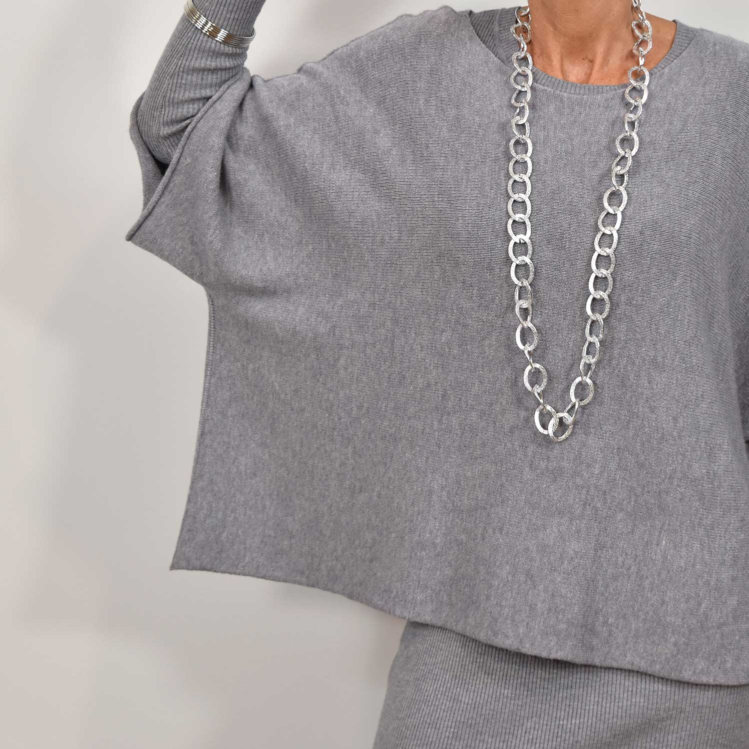 Pull poncho gris