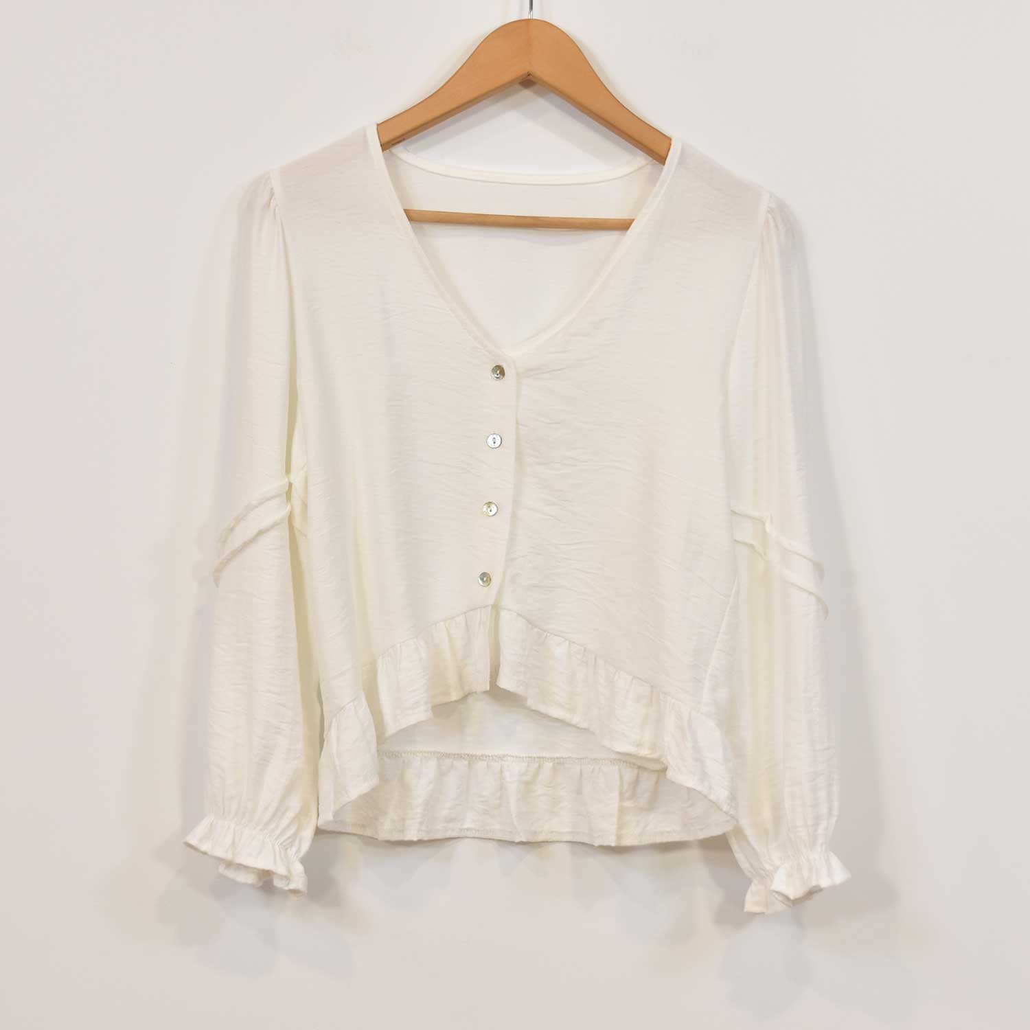 White ruffle blouse