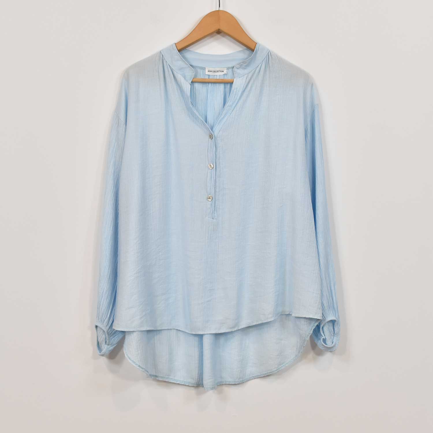 Light blue ruffled blouse