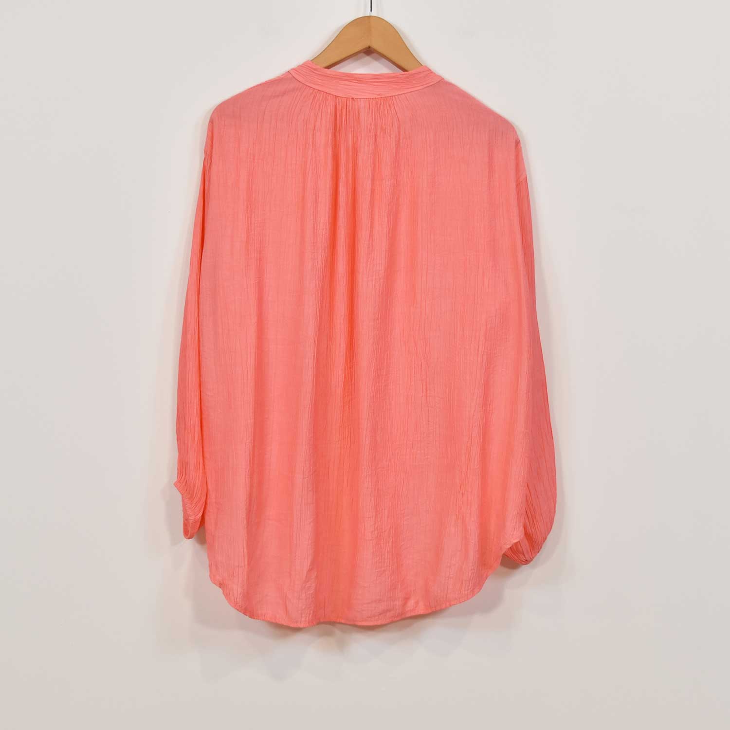 Coral ruffled blouse
