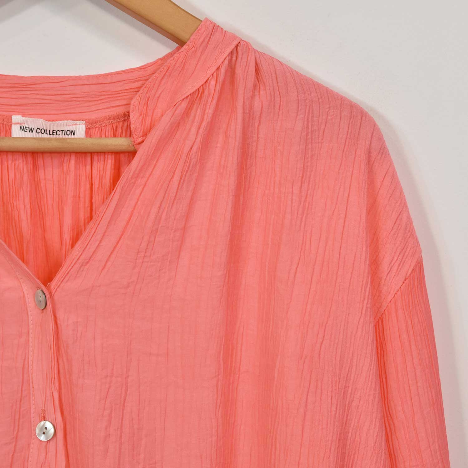 Coral ruffled blouse