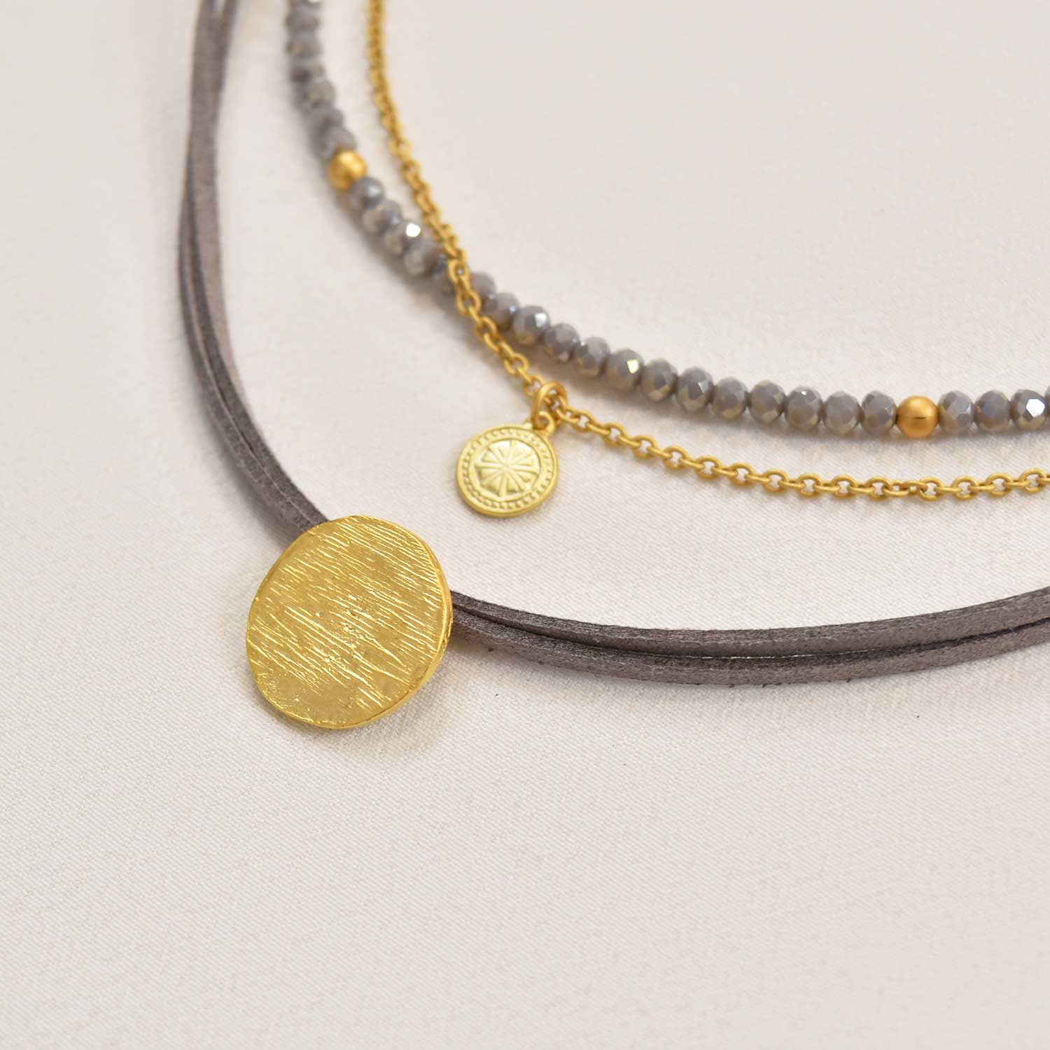 Gold gray triple medal necklace