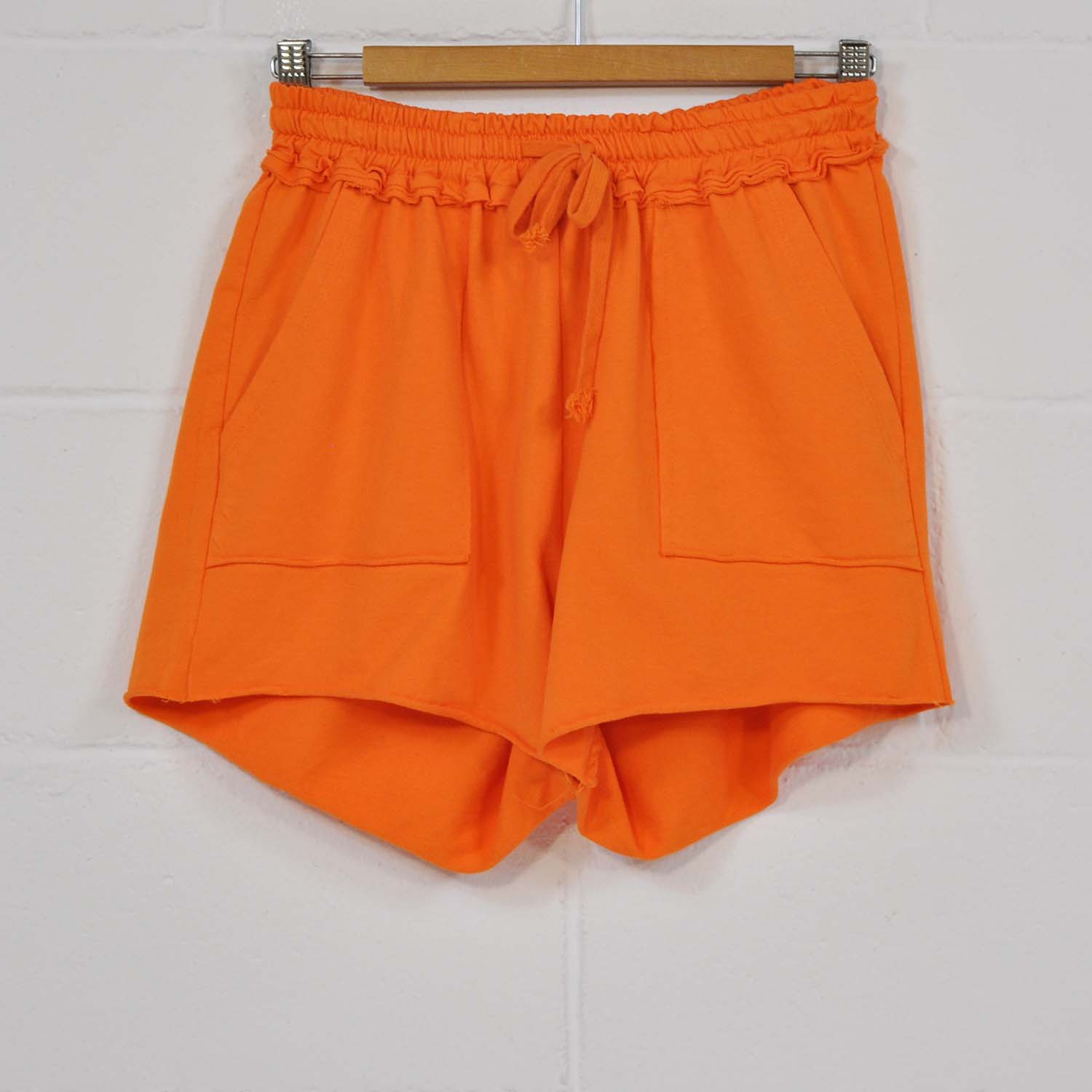 Orange pocket shorts