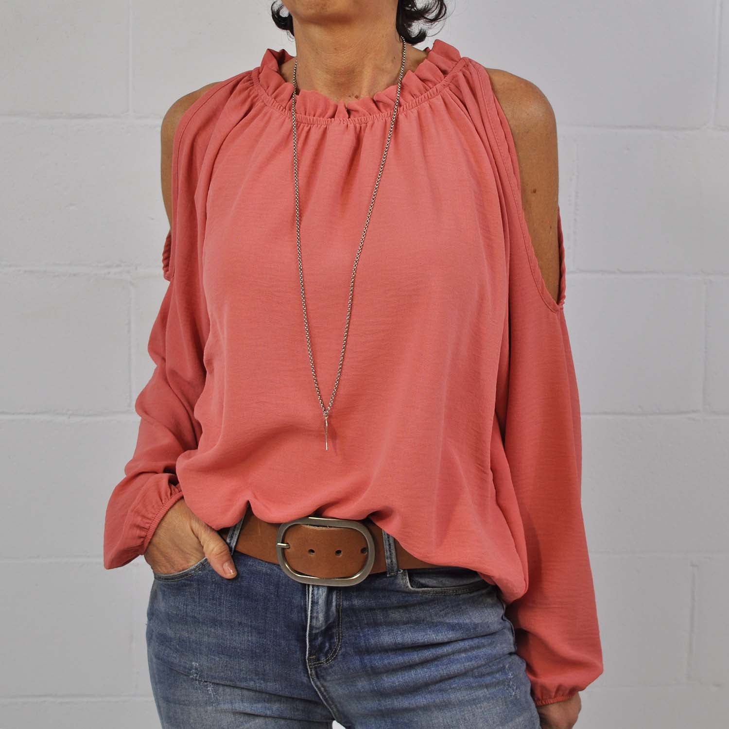 Coral blouse with cut-out shoulders